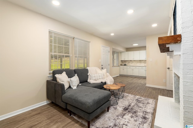 1324 W Navajo Dr, Alabaster, AL 35007 - living area featuring dark wood-style flooring, a fireplace, baseboards, and recessed lighting