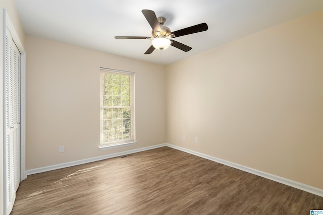 1324 W Navajo Dr, Alabaster, AL 35007 - unfurnished bedroom featuring visible vents, baseboards, a closet, and wood finished floors