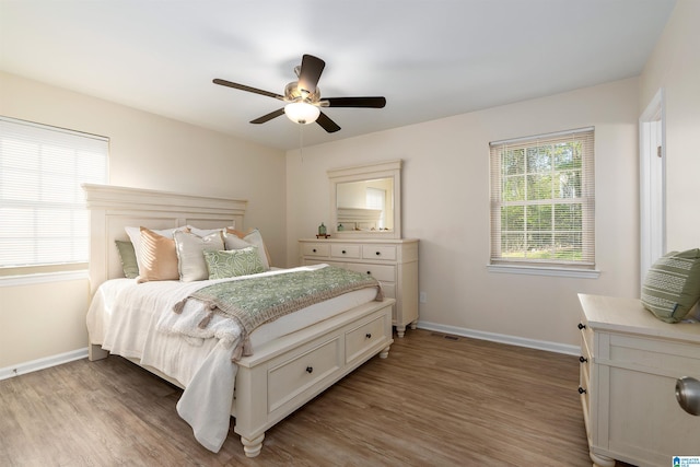 1324 W Navajo Dr, Alabaster, AL 35007 - bedroom with ceiling fan, baseboards, visible vents, and wood finished floors