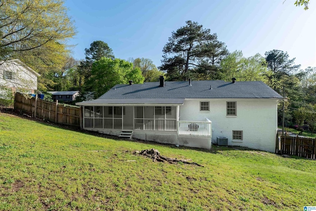 1324 W Navajo Dr, Alabaster, AL 35007 - rear view of house with roof with shingles, central AC unit, a sunroom, a yard, and fence