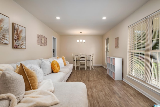 1324 W Navajo Dr, Alabaster, AL 35007 - living area featuring recessed lighting, baseboards, an inviting chandelier, and wood finished floors