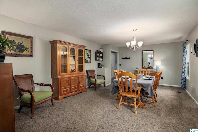470 16th St, Calera, AL 35040 - dining room with baseboards, a notable chandelier, carpet floors, and a textured ceiling
