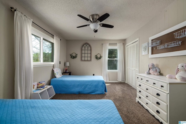 470 16th St, Calera, AL 35040 - bedroom featuring ceiling fan, a closet, dark carpet, and a textured ceiling