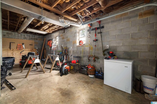 470 16th St, Calera, AL 35040 - below grade area featuring concrete block wall and white refrigerator