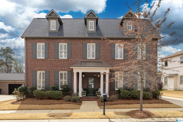 4460 Tuckahoe Ln, Hoover, AL 35226 - colonial home featuring a porch, a shingled roof, and brick siding