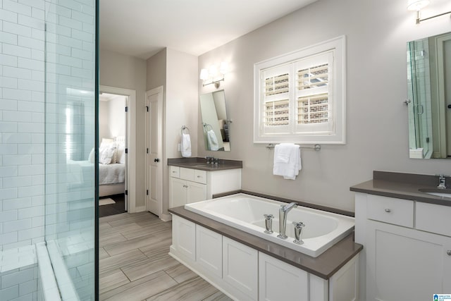 4460 Tuckahoe Ln, Hoover, AL 35226 - ensuite bathroom featuring a sink, ensuite bathroom, a bath, and two vanities