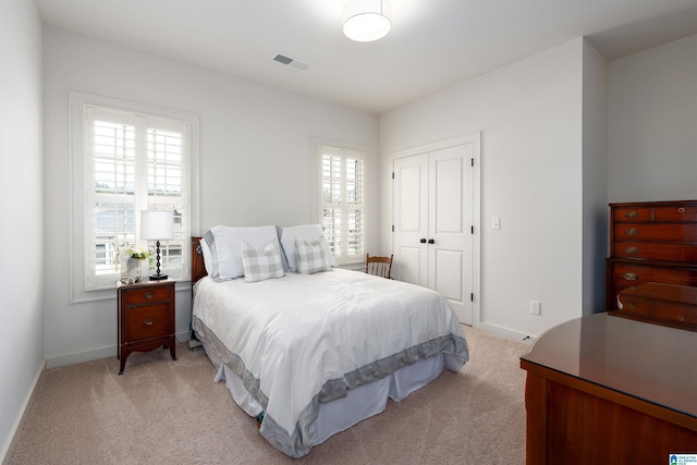 4460 Tuckahoe Ln, Hoover, AL 35226 - bedroom featuring multiple windows, light colored carpet, and baseboards