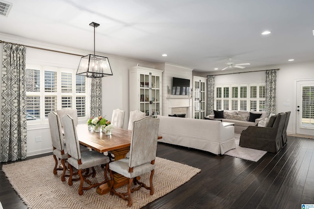 4460 Tuckahoe Ln, Hoover, AL 35226 - dining room featuring recessed lighting, a fireplace, crown molding, dark wood-type flooring, and ceiling fan with notable chandelier
