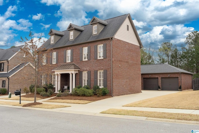 4460 Tuckahoe Ln, Hoover, AL 35226 - georgian-style home featuring a shingled roof, driveway, and brick siding