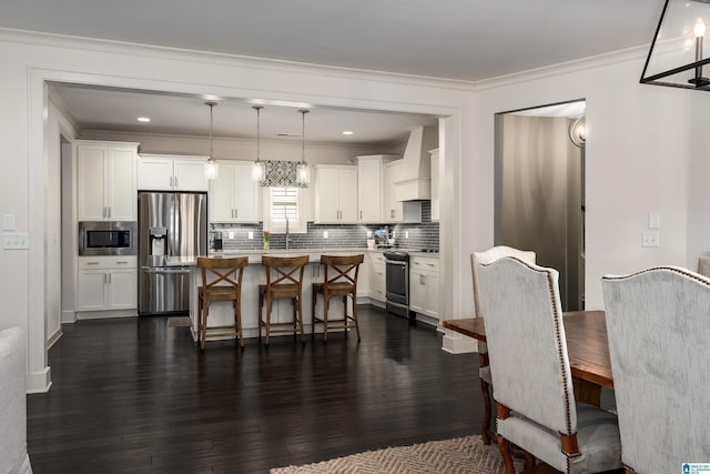 4460 Tuckahoe Ln, Hoover, AL 35226 - dining space featuring dark wood-style flooring and ornamental molding