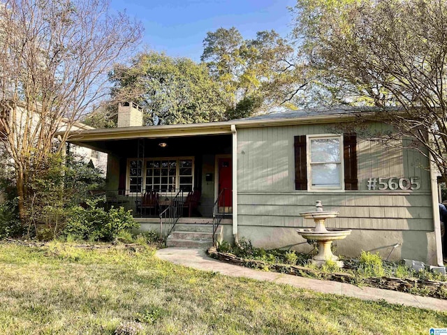 5605 7th Ave S, Birmingham, AL 35212 - view of front of house with a chimney, covered porch, and a front yard