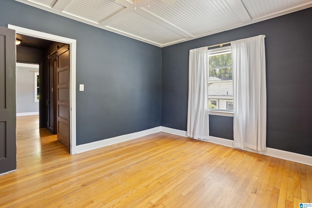 5605 7th Ave S, Birmingham, AL 35212 - unfurnished room with baseboards and light wood-style floors