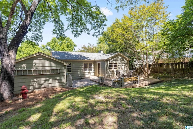 5605 7th Ave S, Birmingham, AL 35212 - rear view of house with a lawn, a patio, and fence