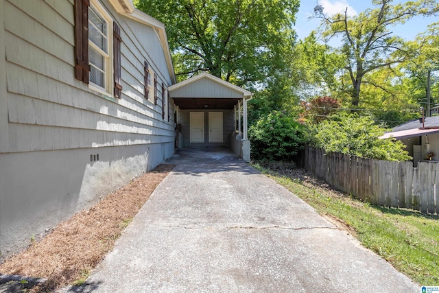 5605 7th Ave S, Birmingham, AL 35212 - exterior space featuring fence, driveway, and a carport