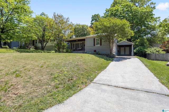 5605 7th Ave S, Birmingham, AL 35212 - single story home featuring concrete driveway, a front lawn, fence, and french doors