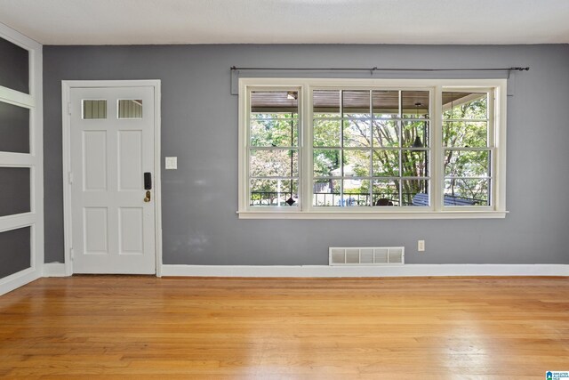 5605 7th Ave S, Birmingham, AL 35212 - entryway with wood finished floors, visible vents, baseboards, and plenty of natural light