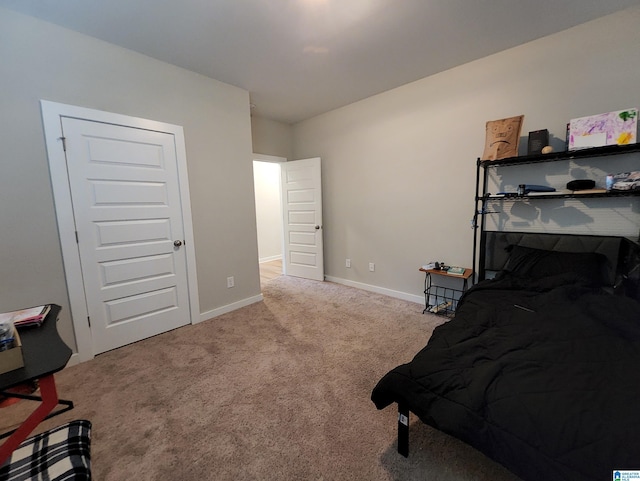 carpeted bedroom with baseboards