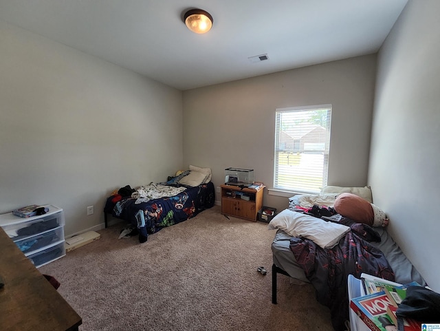 bedroom featuring carpet flooring and visible vents