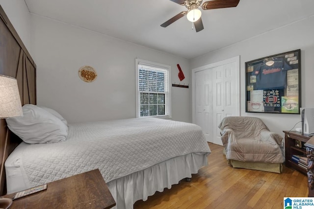 bedroom with a closet, ceiling fan, and hardwood / wood-style floors