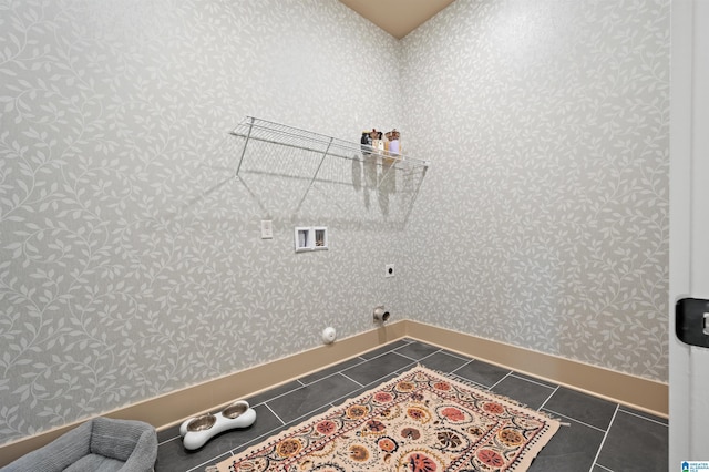 laundry room with laundry area, dark tile patterned floors, baseboards, wallpapered walls, and hookup for a washing machine