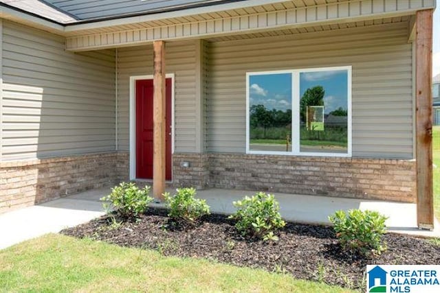 120 Woodland Way, Pell City, AL 35125 - view of exterior entry with brick siding