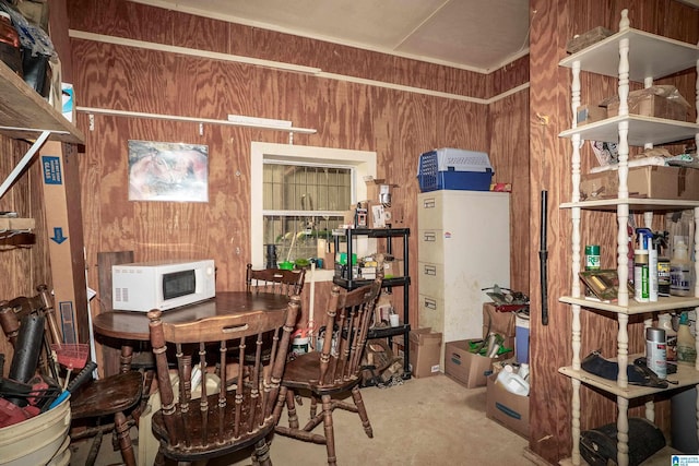 2240 Hillview Rd, Birmingham, AL 35022 - dining area with concrete flooring and wood walls