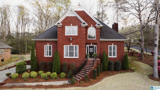 100 Edgewood Cir, Oneonta, AL 35121 - traditional-style home with a chimney, a shingled roof, and brick siding