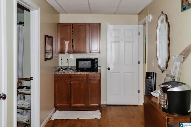 100 Edgewood Cir, Oneonta, AL 35121 - kitchen featuring stone countertops, a drop ceiling, and dark wood-style flooring