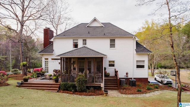 100 Edgewood Cir, Oneonta, AL 35121 - back of house featuring a lawn, a sunroom, and roof with shingles