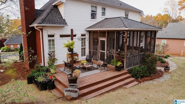 100 Edgewood Cir, Oneonta, AL 35121 - back of house with a sunroom, a chimney, brick siding, and roof with shingles