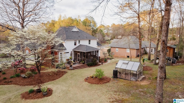 100 Edgewood Cir, Oneonta, AL 35121 - rear view of property with a lawn, an outdoor structure, and a greenhouse