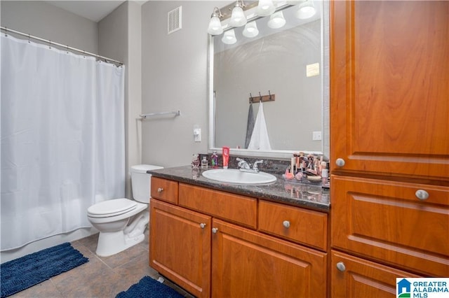 600 13th St E Unit 914, Tuscaloosa, AL 35401 - bathroom featuring vanity, toilet, tile patterned floors, and shower / bathtub combination with curtain