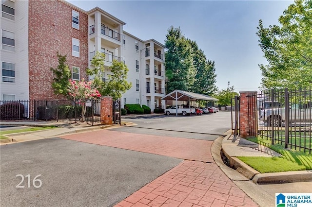 600 13th St E Unit 914, Tuscaloosa, AL 35401 - view of street with curbs, a gated entry, and sidewalks