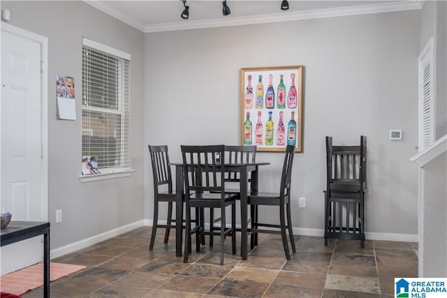 600 13th St E Unit 914, Tuscaloosa, AL 35401 - dining area featuring stone tile flooring, crown molding, and baseboards