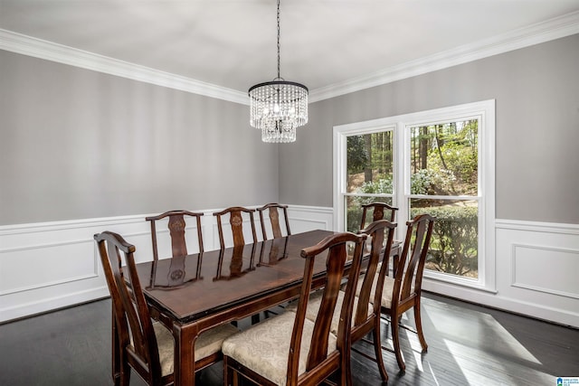 4049 Water Willow Ln, Hoover, AL 35244 - dining area featuring dark wood finished floors, an inviting chandelier, ornamental molding, and a wainscoted wall