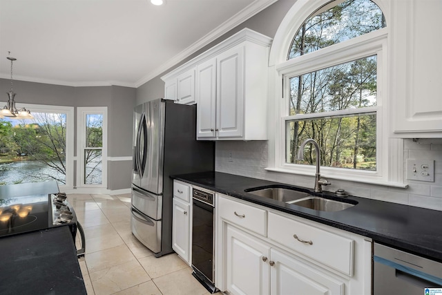 4049 Water Willow Ln, Hoover, AL 35244 - kitchen with white cabinets, a sink, ornamental molding, and dark countertops