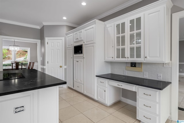 4049 Water Willow Ln, Hoover, AL 35244 - kitchen featuring a chandelier, glass insert cabinets, white cabinets, and dark countertops