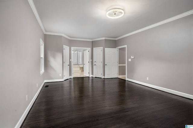 4049 Water Willow Ln, Hoover, AL 35244 - unfurnished bedroom with ensuite bathroom, baseboards, an inviting chandelier, crown molding, and dark wood-type flooring