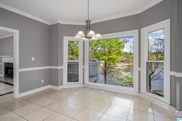 4049 Water Willow Ln, Hoover, AL 35244 - unfurnished dining area with ornamental molding, baseboards, plenty of natural light, and an inviting chandelier
