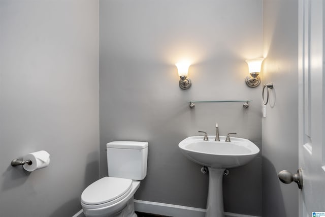 4049 Water Willow Ln, Hoover, AL 35244 - half bath with a sink, toilet, and baseboards