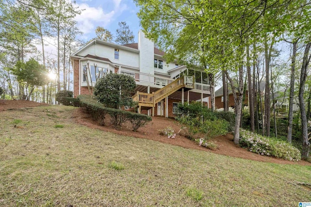 4049 Water Willow Ln, Hoover, AL 35244 - back of house with a deck, a lawn, a chimney, stairway, and brick siding