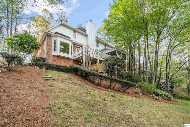 4049 Water Willow Ln, Hoover, AL 35244 - view of home's exterior featuring a chimney, a lawn, and brick siding