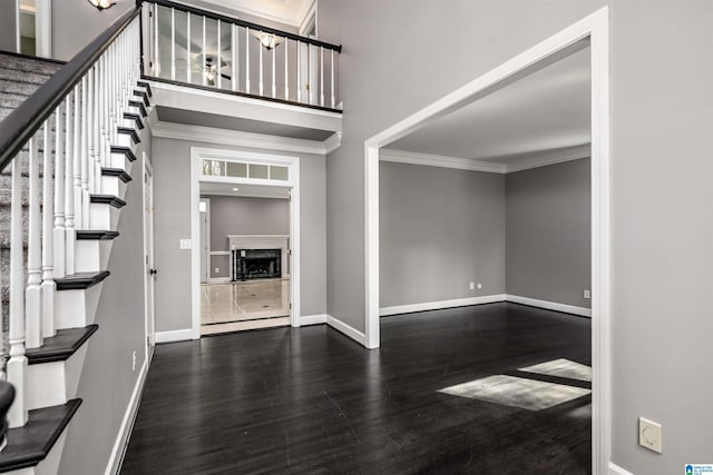 4049 Water Willow Ln, Hoover, AL 35244 - foyer featuring ornamental molding, stairway, a high ceiling, wood finished floors, and baseboards