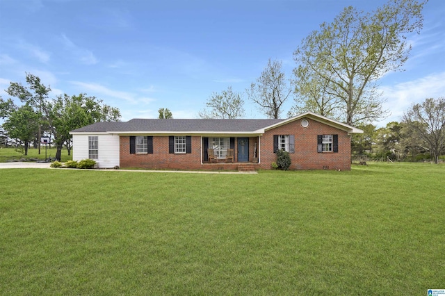 ranch-style home featuring covered porch, brick siding, and a front lawn