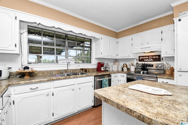 kitchen featuring ornamental molding, appliances with stainless steel finishes, under cabinet range hood, white cabinetry, and a sink