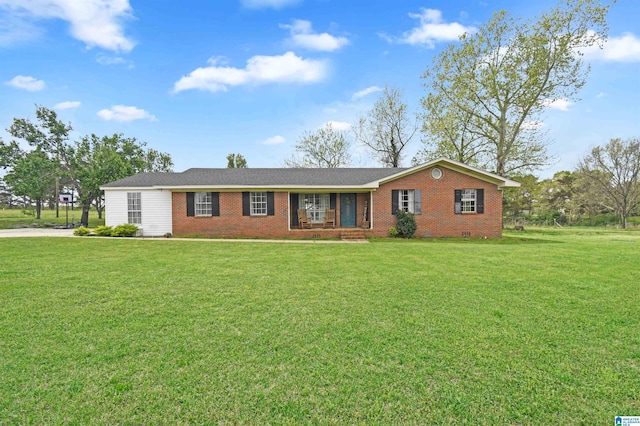 ranch-style home featuring a front lawn and brick siding