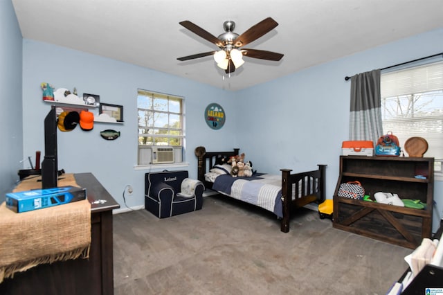 bedroom featuring carpet flooring, cooling unit, and ceiling fan