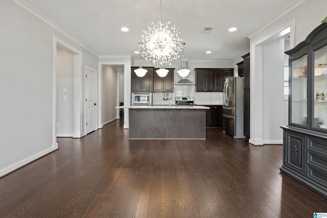 kitchen with light countertops, appliances with stainless steel finishes, a chandelier, dark brown cabinets, and backsplash