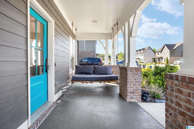 view of patio featuring a residential view and covered porch