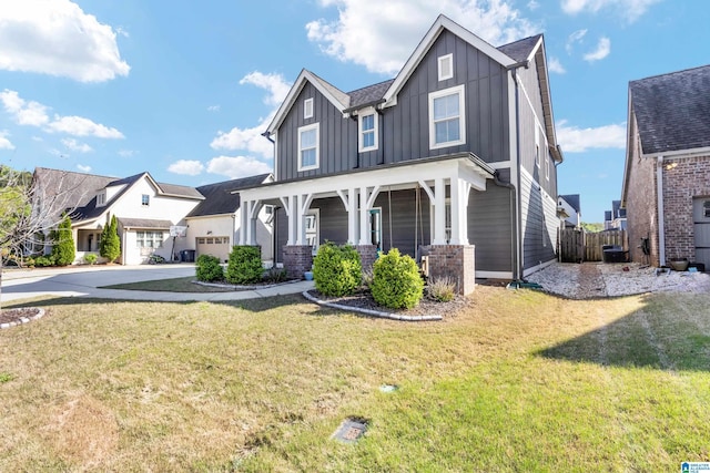 view of front of home featuring covered porch, a garage, board and batten siding, concrete driveway, and a front lawn